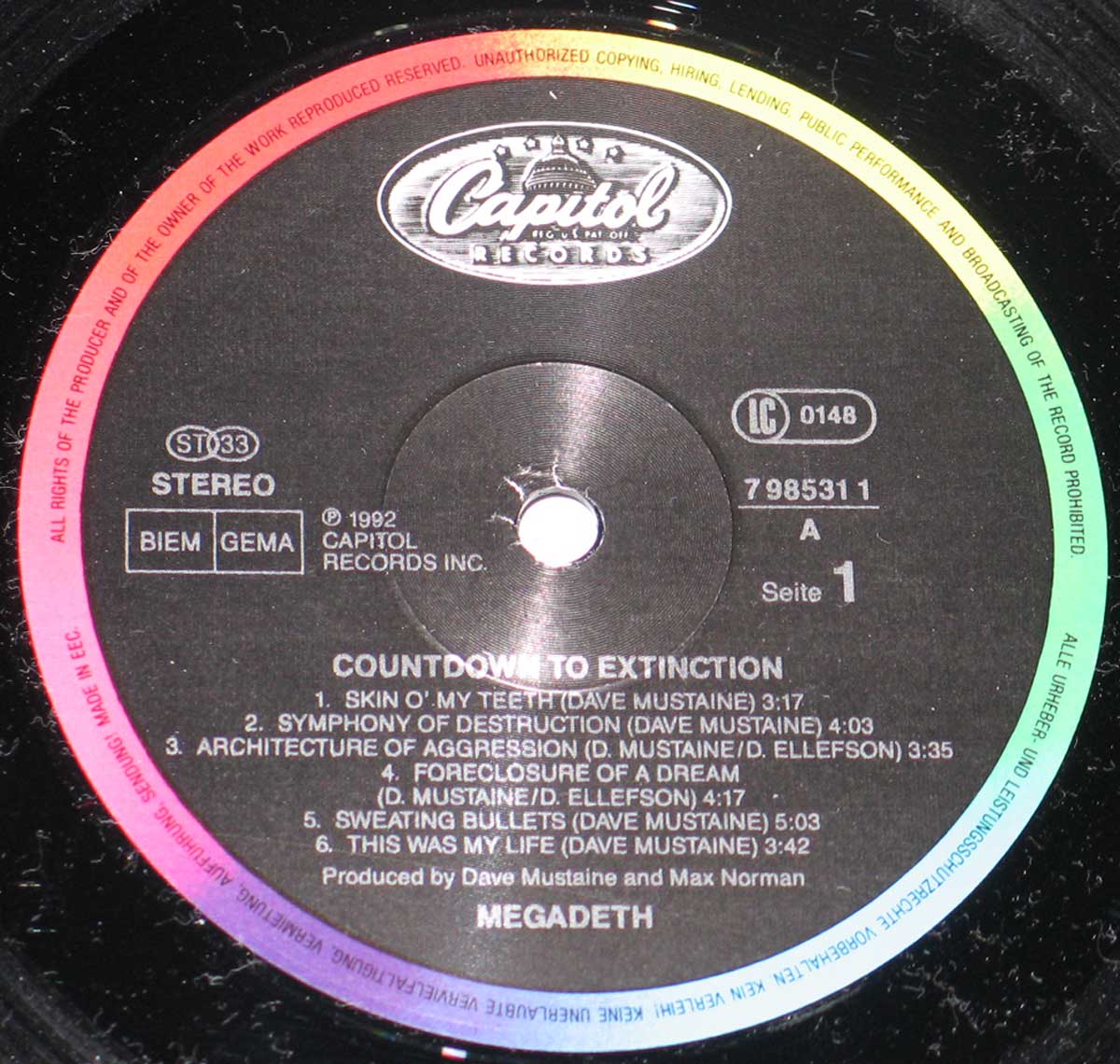 Close-up of Side A record label from Megadeth's Countdown to Extinction, featuring Capitol Records rainbow rim design, tracklist, and production credits.
