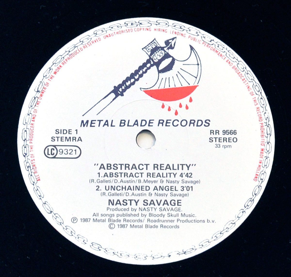 Close-up of Side One label of 'Abstract Reality' by Nasty Savage. Features Metal Blade Records logo with a bleeding battle axe. Includes track listing for Side One, copyright details, and mentions of Roadrunner Productions and Bloody Skull Music.