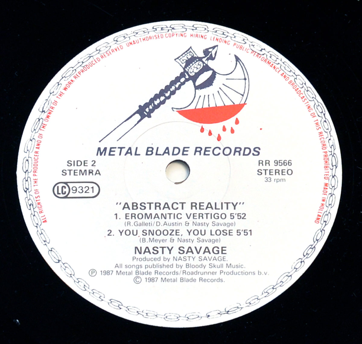 Close-up of Side Two of the 'Abstract Reality' vinyl record by Nasty Savage, released on Metal Blade Records in 1987. The label is white with black and red text, featuring the Metal Blade logo: a medieval axe with a blood-dripping blade. Tracklist includes 'Eromatic Vertigo' and 'You Snooze, You Lose'. Circular border with red text prohibits unauthorized copying.