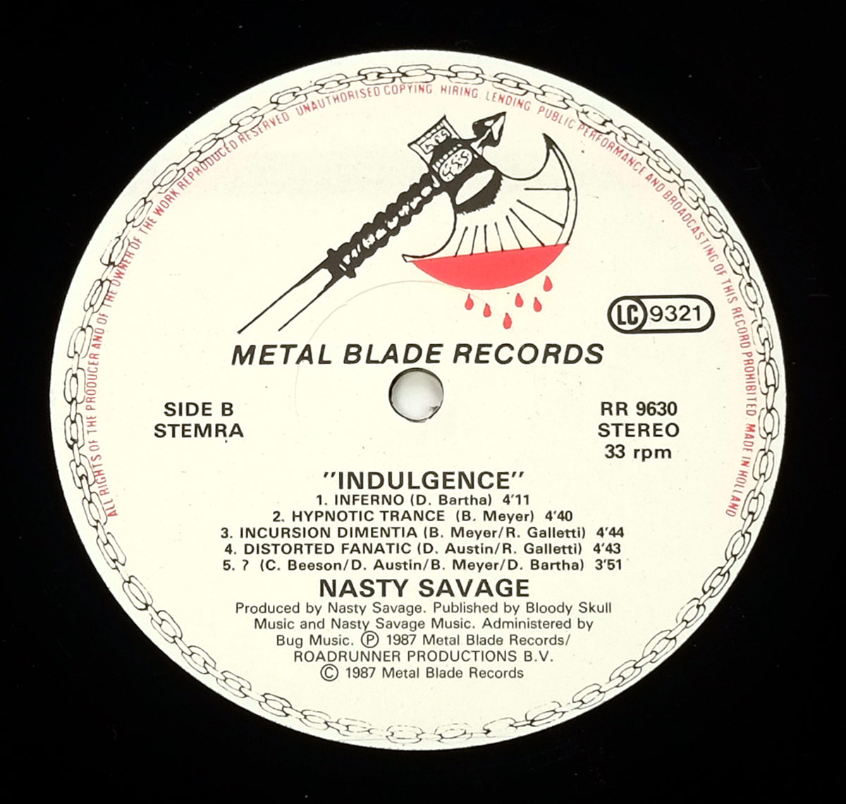 Close-up of Side Two record label for NASTY SAVAGE - Indulgence. Features the Metal Blade Records axe logo, track listing, catalog number RR 9630, and production credits.