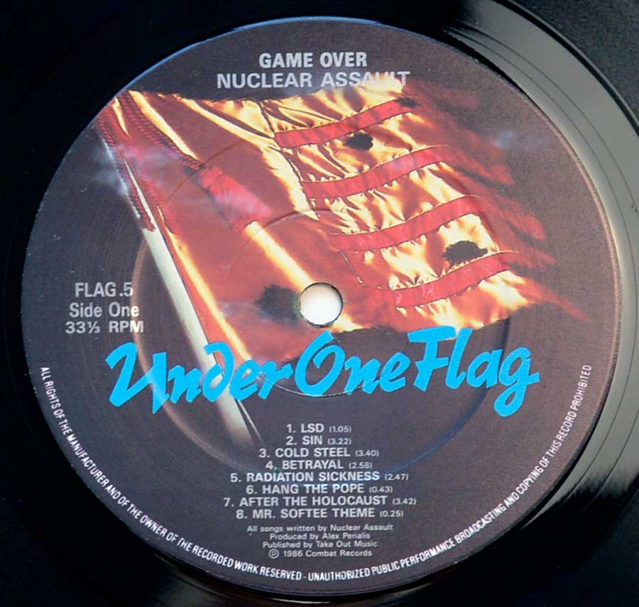 Close up of record's label NUCLEAR ASSAULT - Game Over ( England Pressing ) Side One