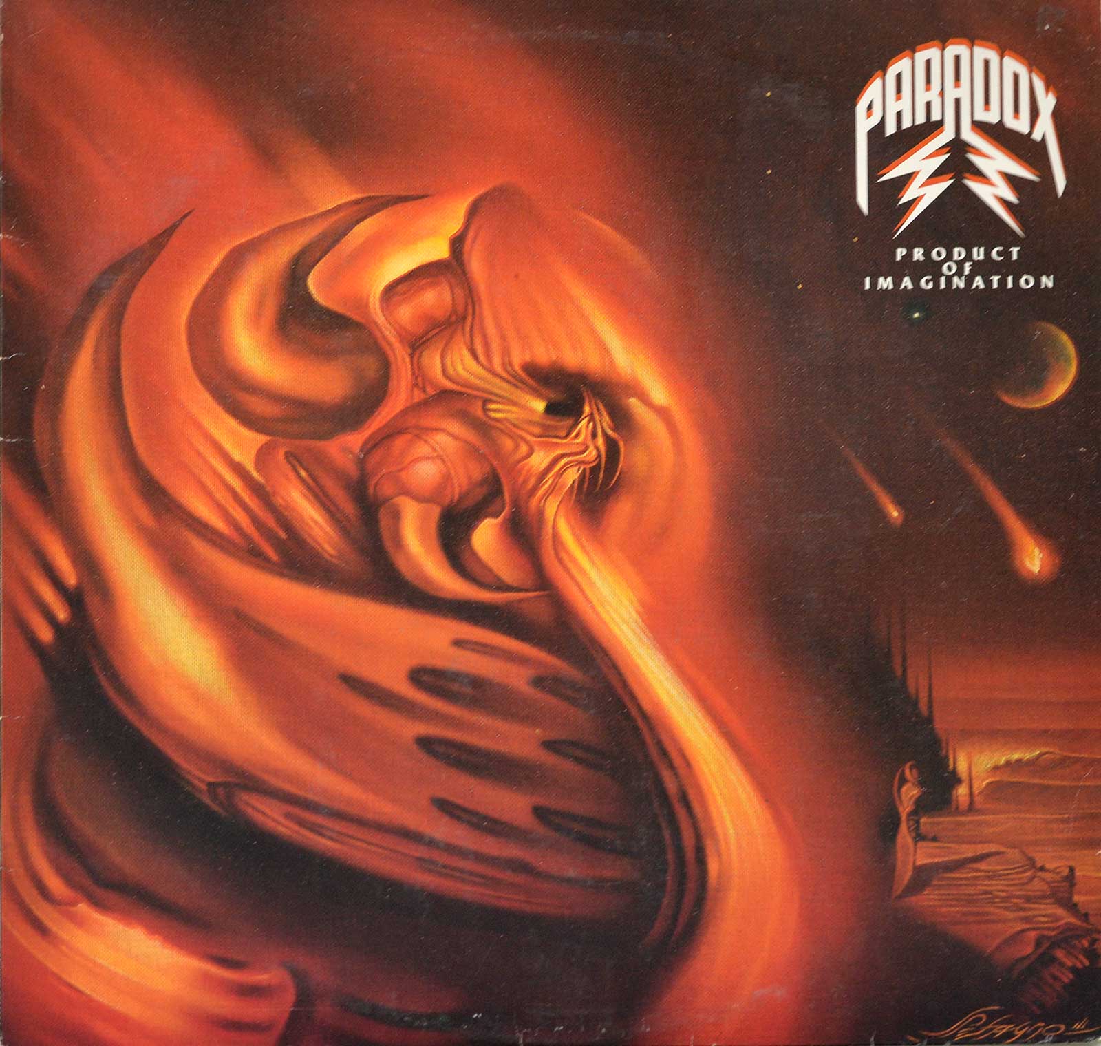 Album cover for Paradox's Product of Imagination. The cover features a surreal, fiery scene with swirling abstract shapes resembling a distorted skull or face engulfed in flames. Comets streak across a dark sky, adding a sense of chaos. The Paradox logo and album title appear in the upper right corner