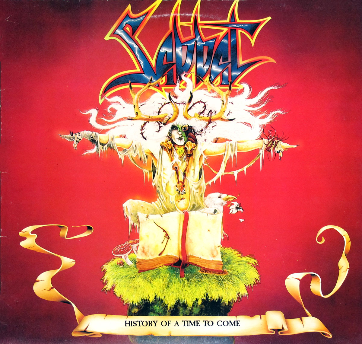 Album cover for Sabbat’s History of a Time to Come, featuring a surreal figure with antlers and skeletal features in a crucifix-like pose, set against a vivid red background. Below the figure is an open mystical book resting on bright green grass, surrounded by fantastical details like mushrooms and scrolls. The band’s sharp-edged logo is prominently displayed at the top, with the album title on a scroll at the bottom. https://vinyl-records.nl 
