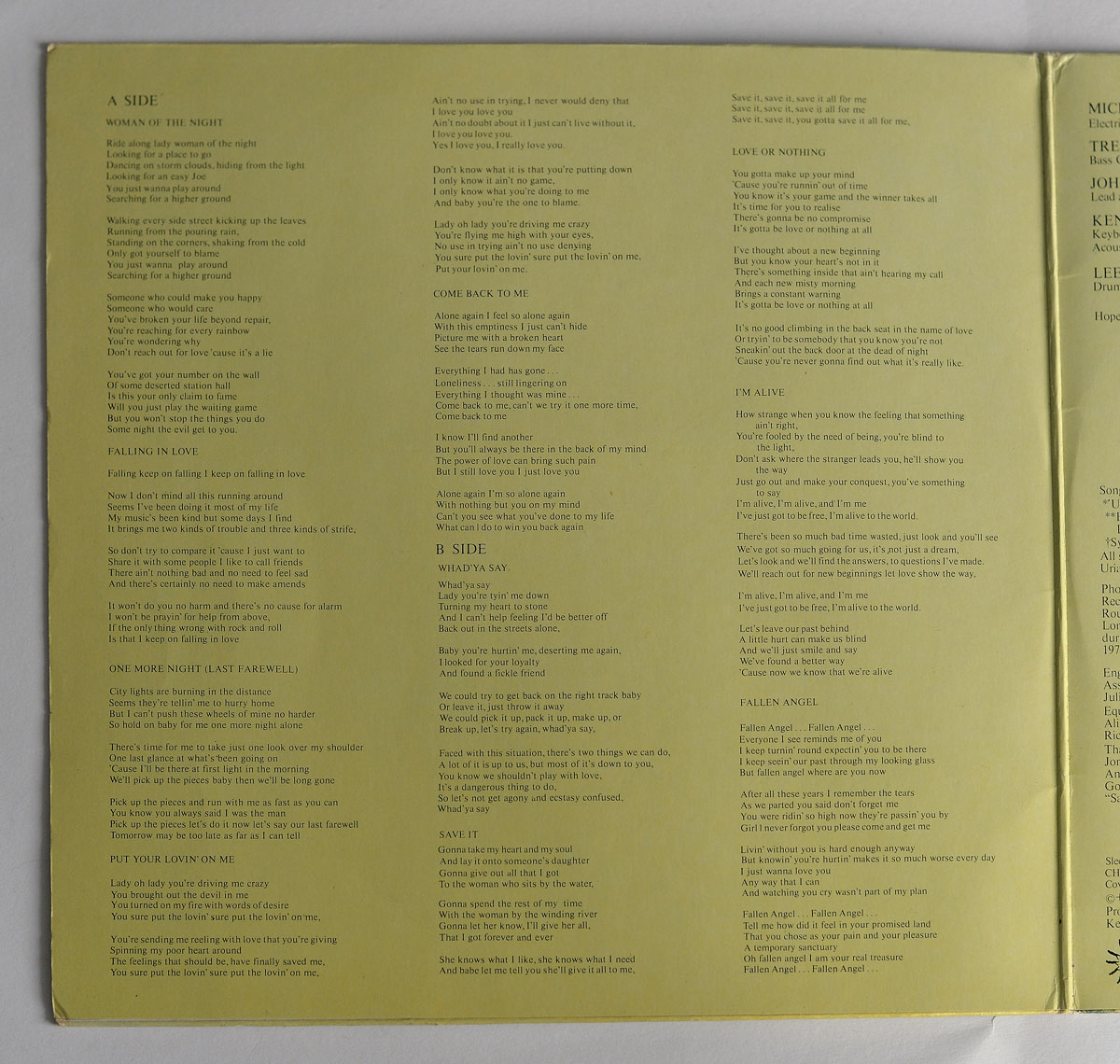 Uriah Heep - Fallen Angel (German Release) left inside page of the gatefold sleeve, displaying full printed lyrics for all songs on side A and side B, including Woman of the Night, Falling in Love, One More Night (Last Farewell), Put Your Lovin' on Me, Come Back to Me, Whad'ya Say, Save It, Love or Nothing, I'm Alive, and Fallen Angel, set in a simple two-column black text layout on a pale yellow background.