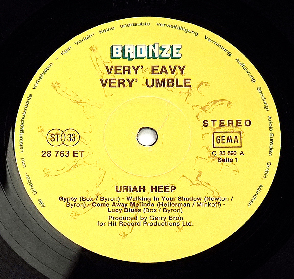 Record label of Uriah Heep's 'Very 'Eavy... Very 'Umble' (German Release), featuring a yellow background with the Bronze Records logo, tracklist, and catalog details.