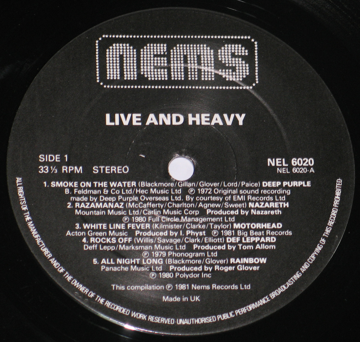 Close up of record's label VARIOUS ARTISTS - Live and Heavy 12" Vinyl LP Album Side One