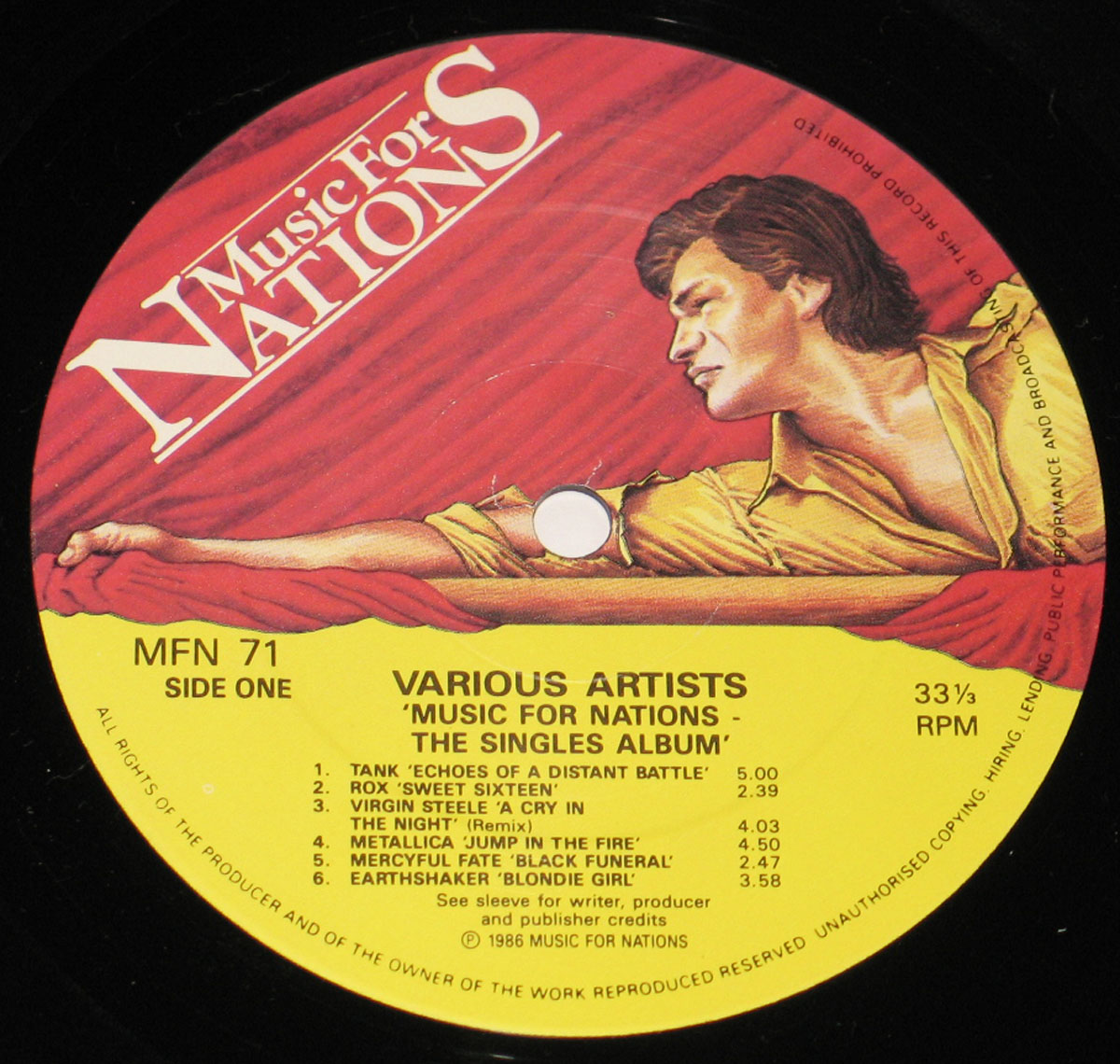 Side One record label of 'Music For Nations: The Singles Album' featuring red and yellow artwork with a stylized man holding a flag, and track listing printed for Side One.