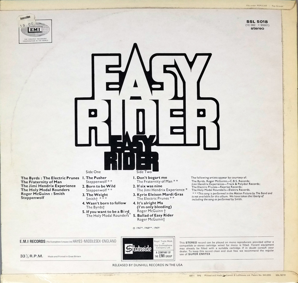 Back cover of the Easy Rider soundtrack album with a white background, bold “Easy Rider” logo in the center, and tracklists for Side One and Side Two. Includes credits for artists such as Steppenwolf, The Byrds, and The Jimi Hendrix Experience. Features EMI and Stateside logos at the bottom and an EMI price sticker in the top-left corner