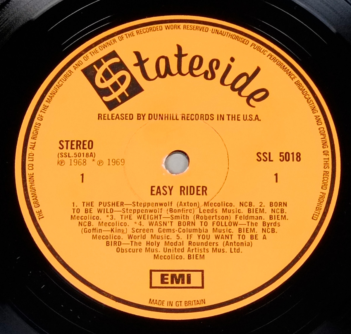 Vinyl label of the Easy Rider soundtrack (Side 1) with an orange background, Stateside logo at the top, tracklist including Steppenwolf’s “Born to Be Wild” and The Byrds’ “Wasn’t Born to Follow.” Catalog number SSL 5018 and EMI logo at the bottom.