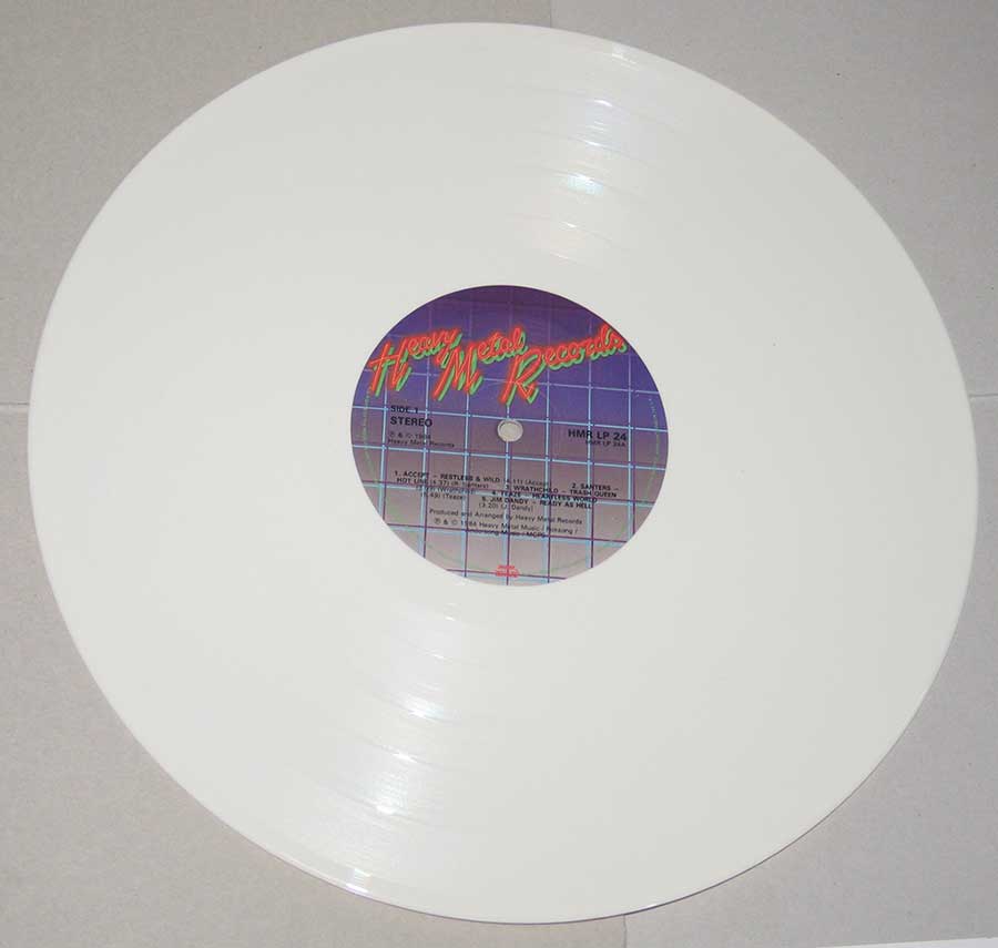 Photo of Side One of VARIOUS ARTISTS - Heavy Metal Records White Vinyl Die-Cut 12" LP 