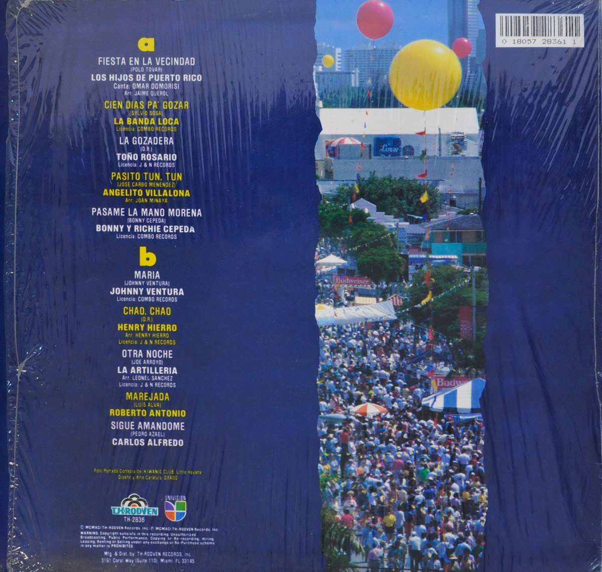 Back cover of Merengue En La Calle Ocho showing a vertical strip of a street festival photo surrounded by deep blue with track listing and artist credits in yellow and white text.