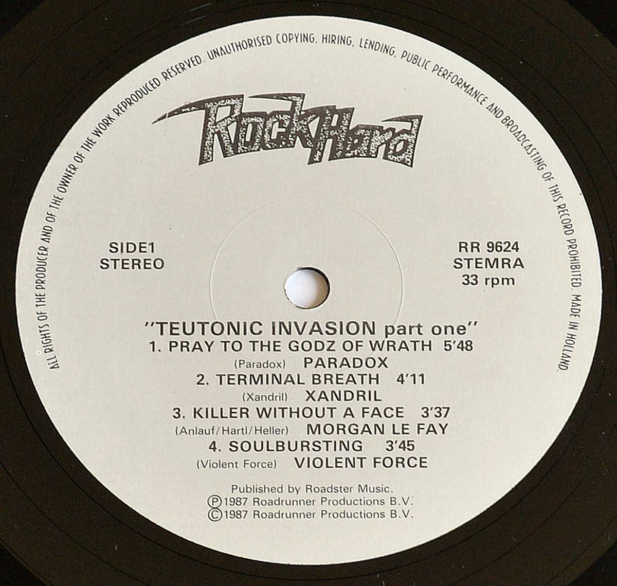 Record label of Teutonic Invasion Part One, Side 1. Features a cream-white background with black text and the Rock Hard magazine logo at the top in a distressed, metallic style. Lists four tracks with their respective bands: “Pray to the Godz of Wrath” by Paradox, “Terminal Breath” by Xandril, “Killer Without a Face” by Morgan Le Fay, and “Soulbursting” by Violent Force. Includes technical details such as “Side 1,” “Stereo,” 33 RPM, catalog number “RR 9624,” and rights organization code “STEMRA.” Published by Roadster Music in 1987 under Roadrunner Productions B.V. https://vinyl-records.nl